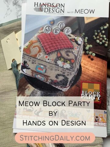 Meow Block Party Pattern on a piece of fabric with threads